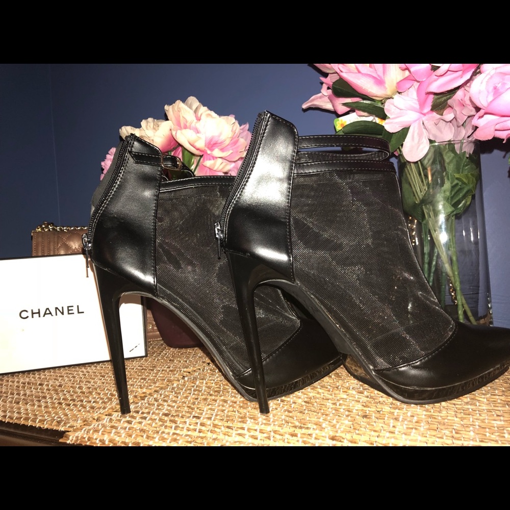 Black sheer heels. Very high heel.